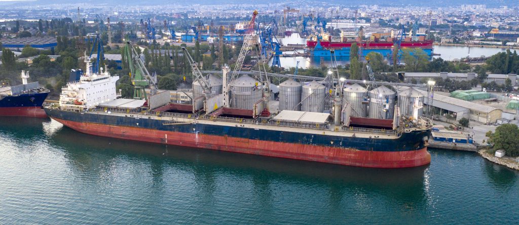 aerial view from a drone of a large ship ready to loading grain for export. water transport