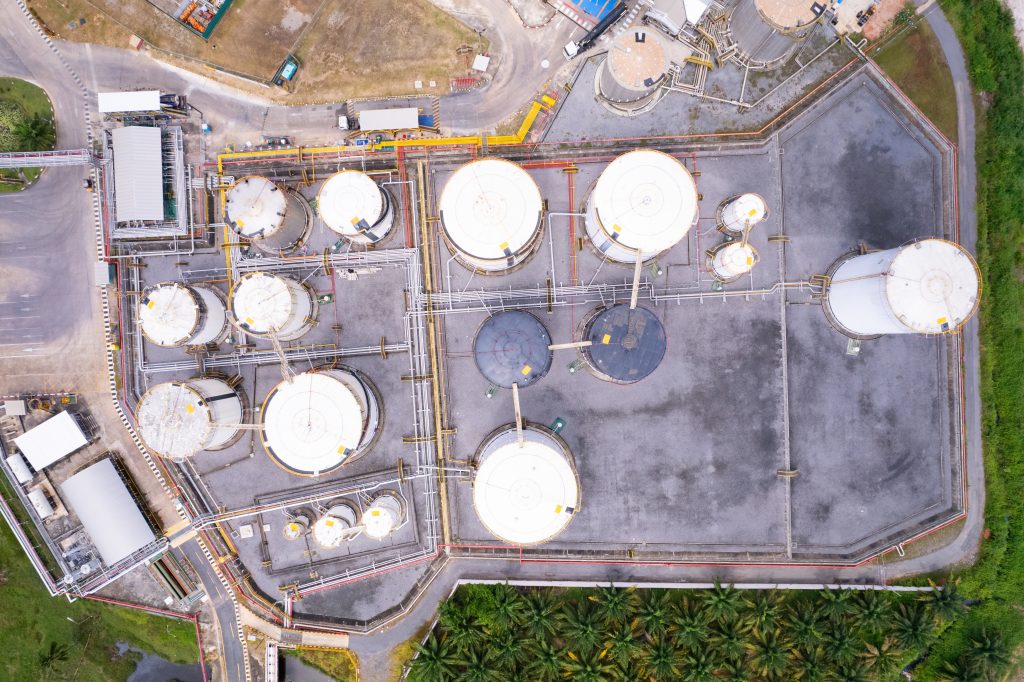 aerial view white fuel storage tank in oil refinery plant. top v